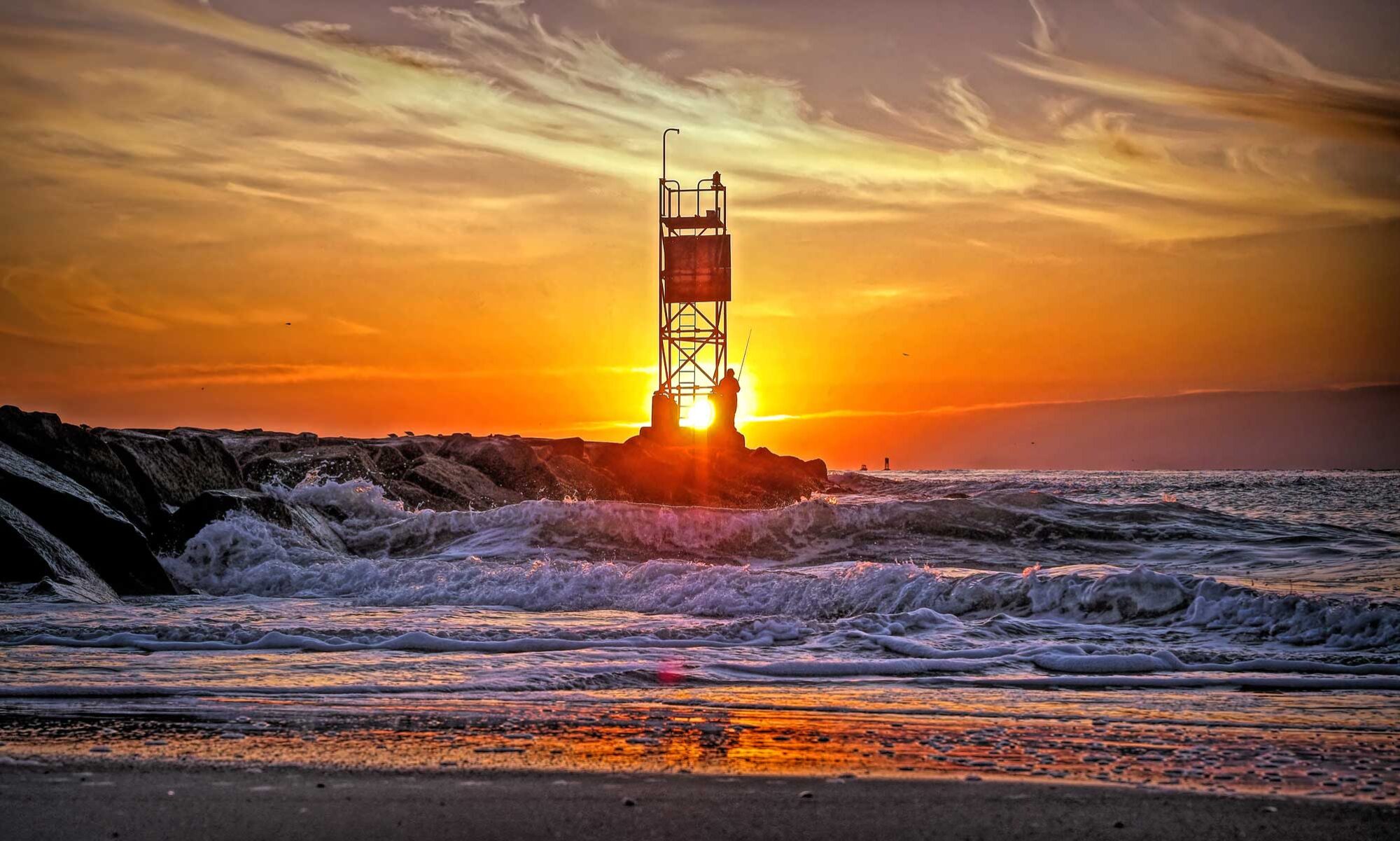 Fishing at sunrise on the Indian River Inlet jetty